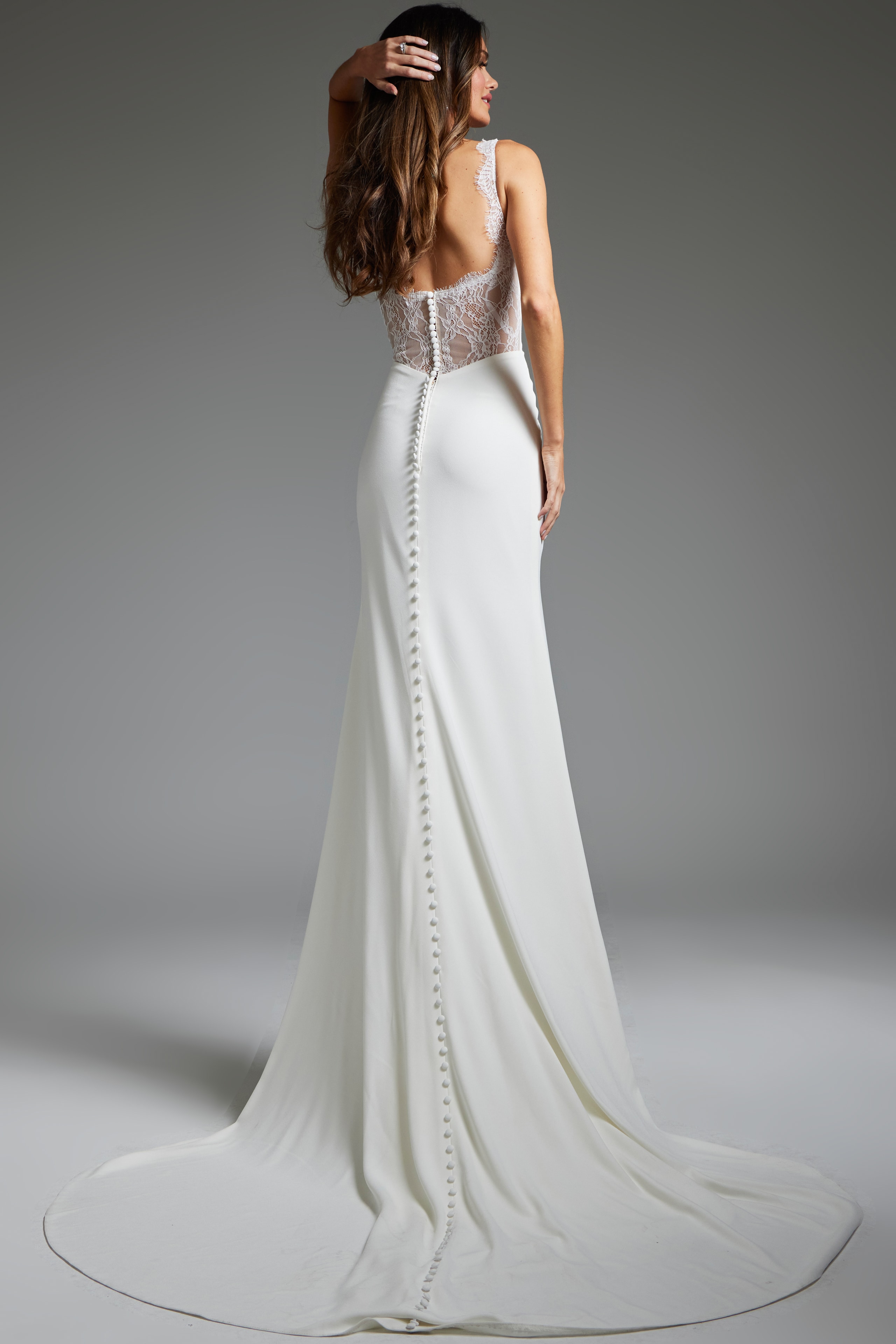 Back view of Jovani JB42222 ivory gown with lace detailing and buttoned train.
