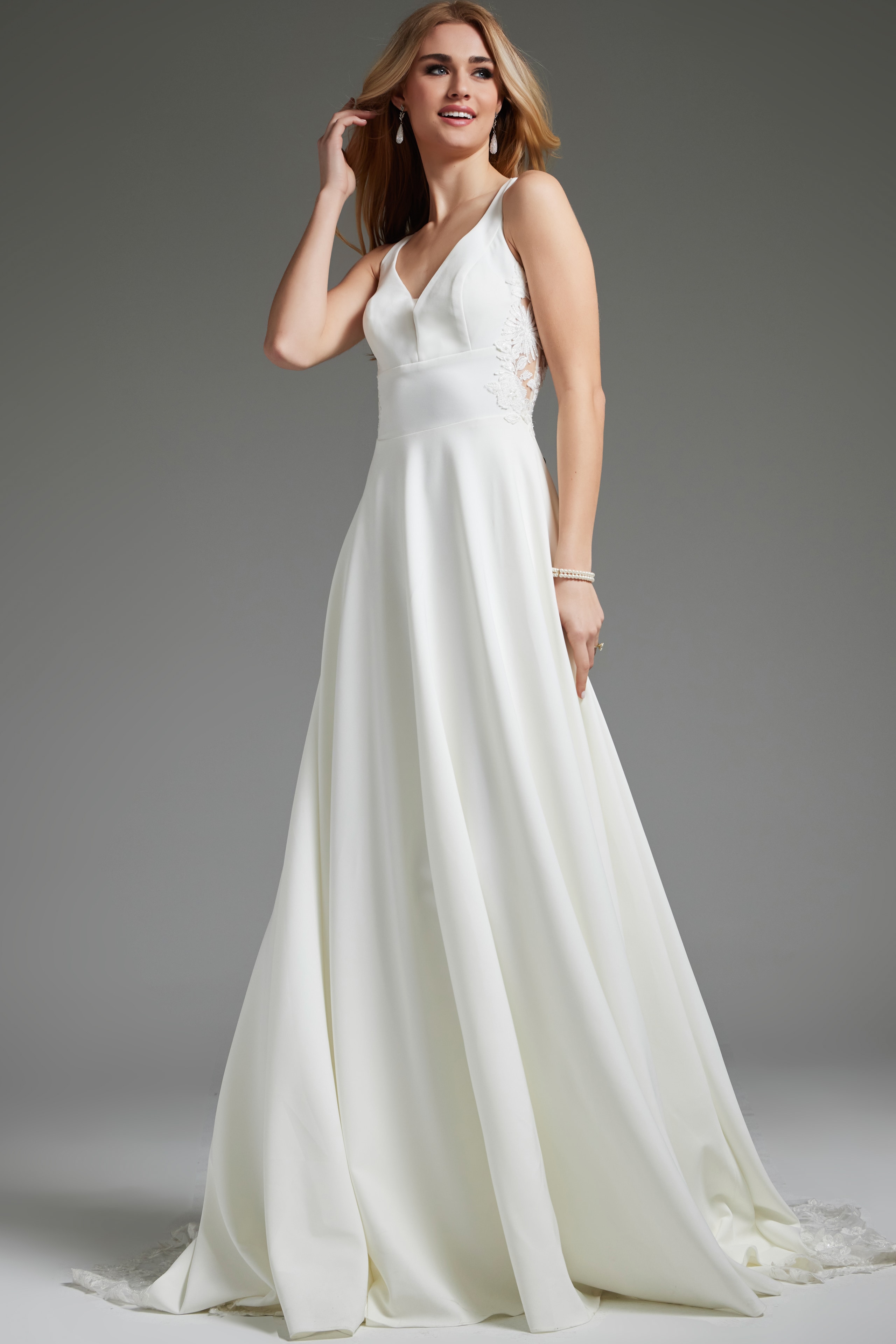 Model wearing Jovani JB42294 ivory dress, front pose showcasing versatile design.