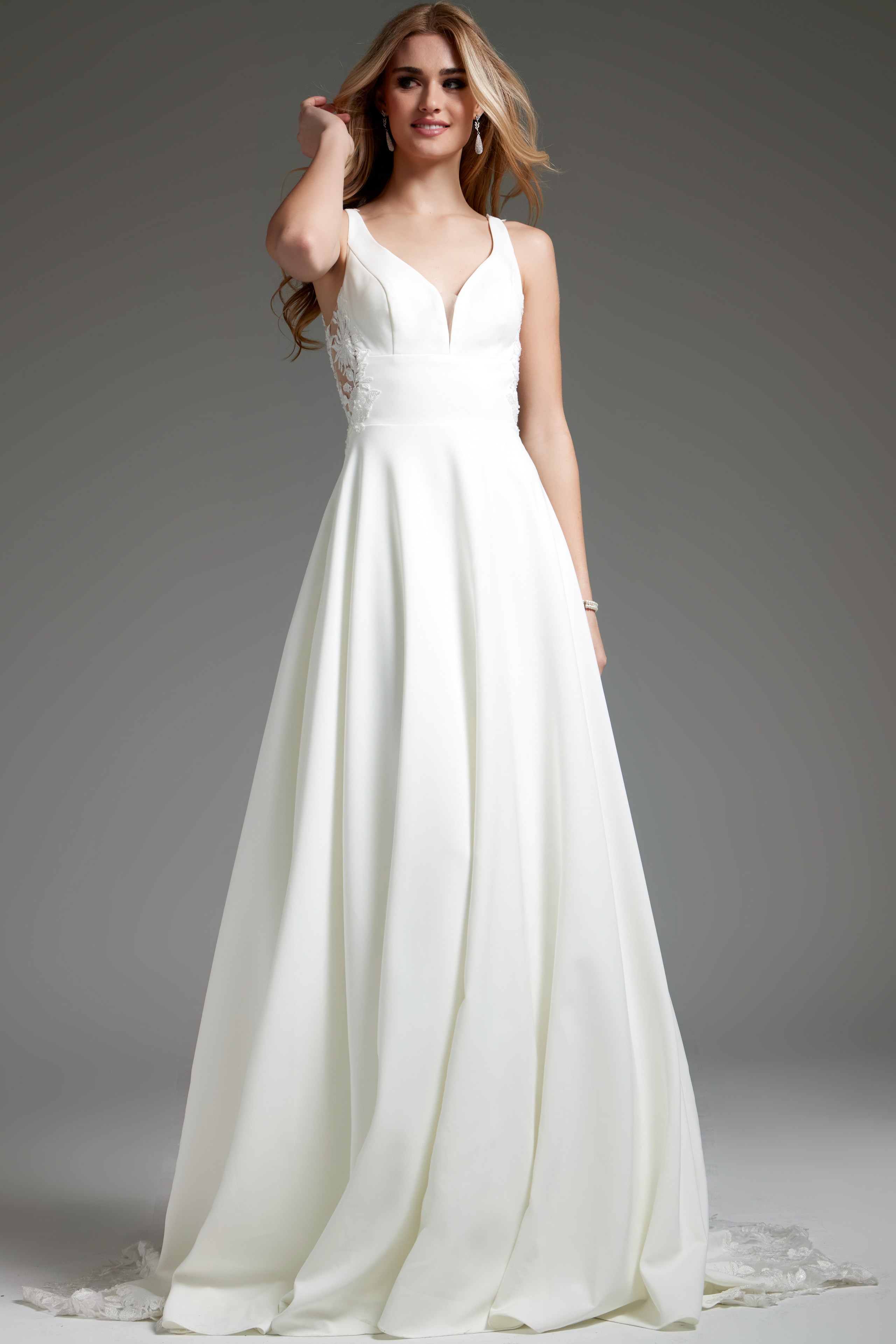 Model wearing Jovani JB42294 ivory dress, front view, featuring a V-neckline and A-line silhouette.