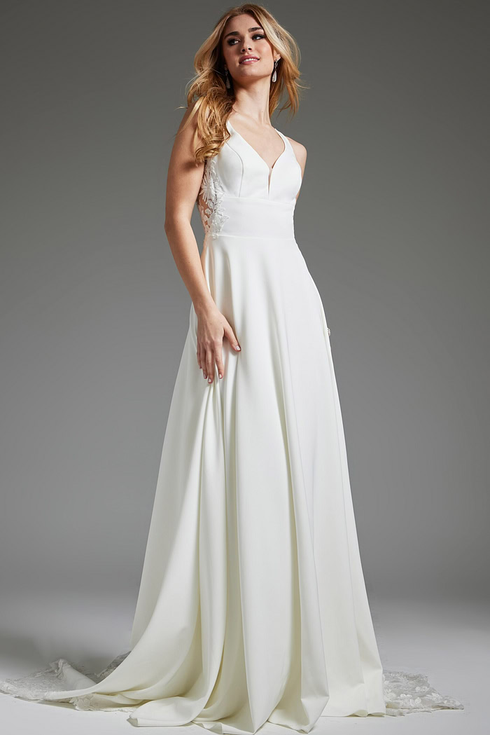 Model in Jovani JB42294 ivory dress, featuring a flowing A-line skirt.