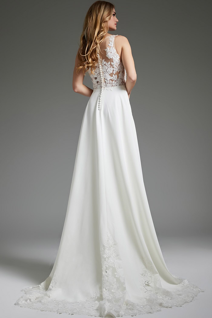 Model showcasing the back of Jovani JB42294 ivory dress with lace detailing and button-up closure.