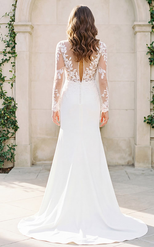 ivory gown from the back, showcasing lace details and train.