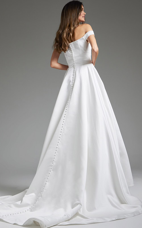 Back view of model in Jovani JB42626 showing the buttoned detail on white dress.
