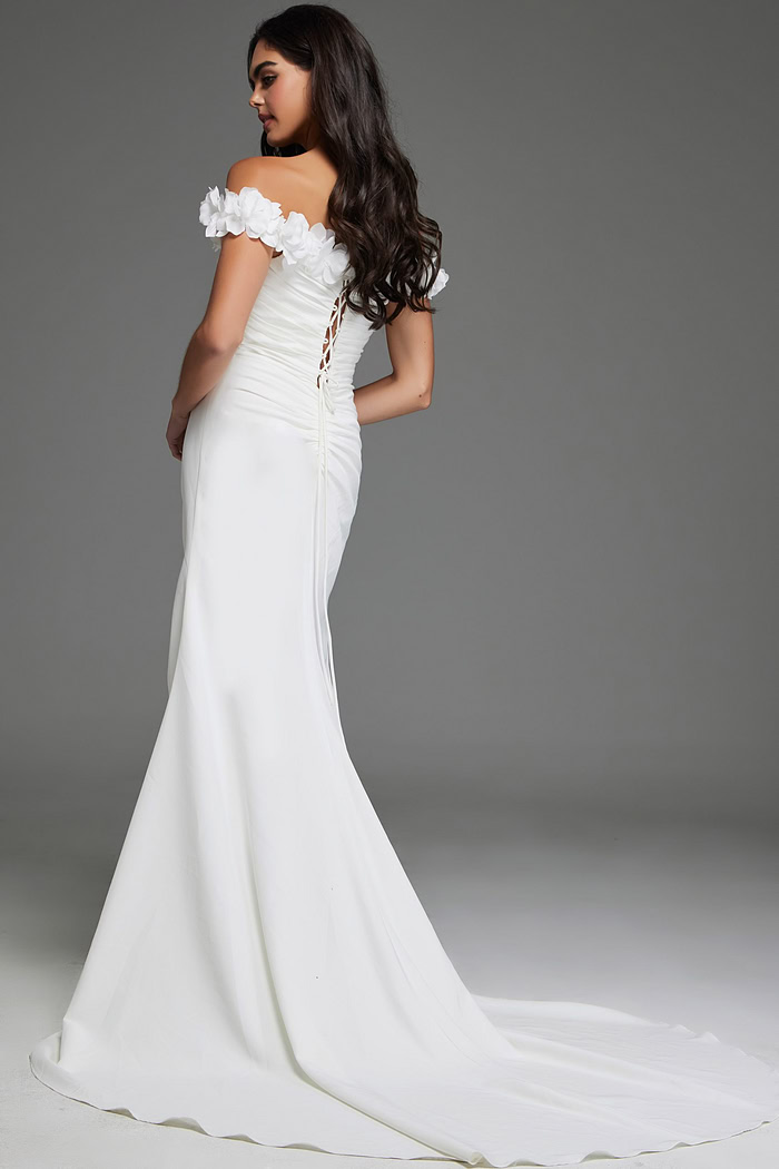 Model wearing Jovani JB43323, ivory dress with lace-up back and floor-length design, showcasing the elegant back view.