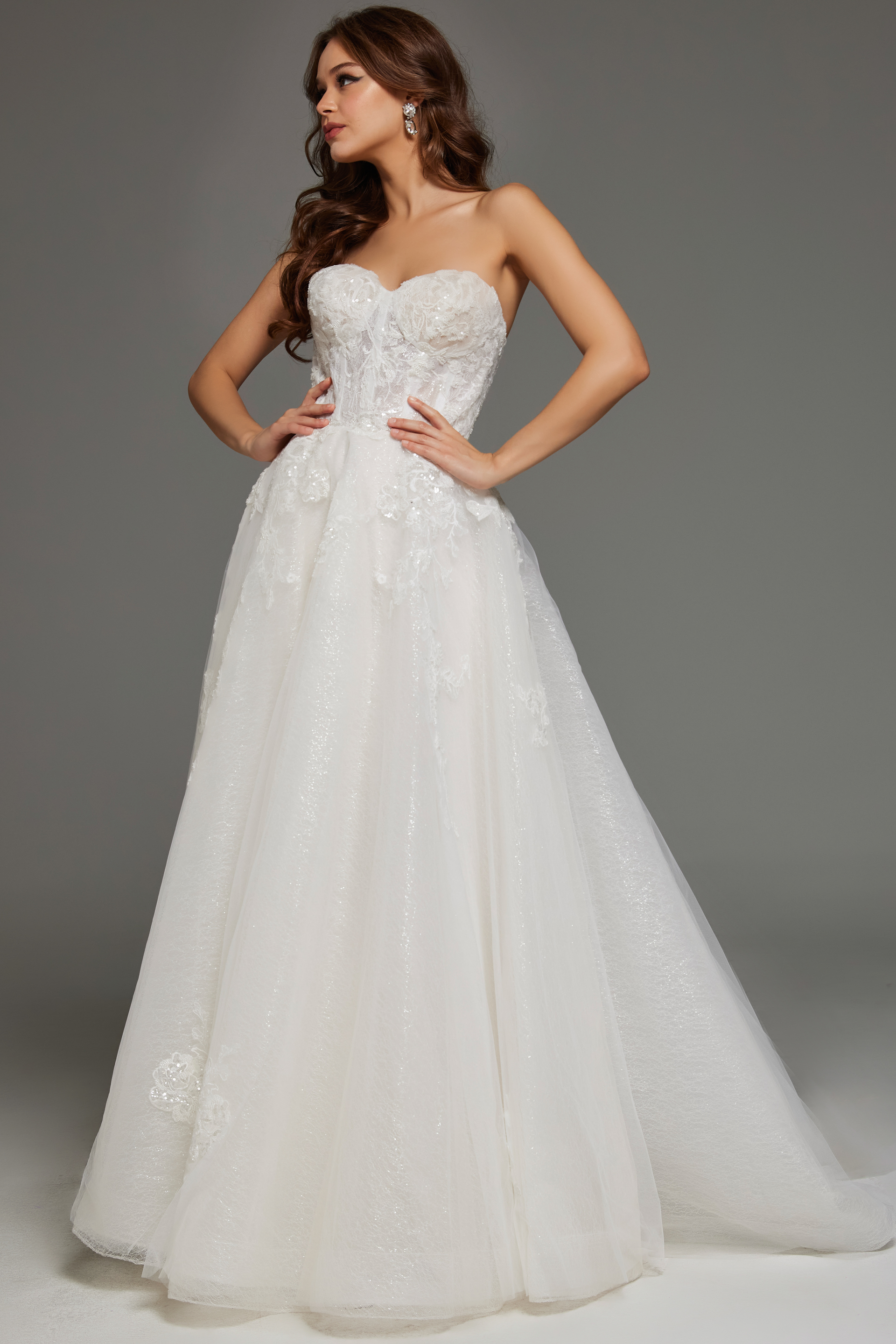 Model wearing Jovani JB43324 ivory dress with sweetheart neckline and lace detailing, front view.
