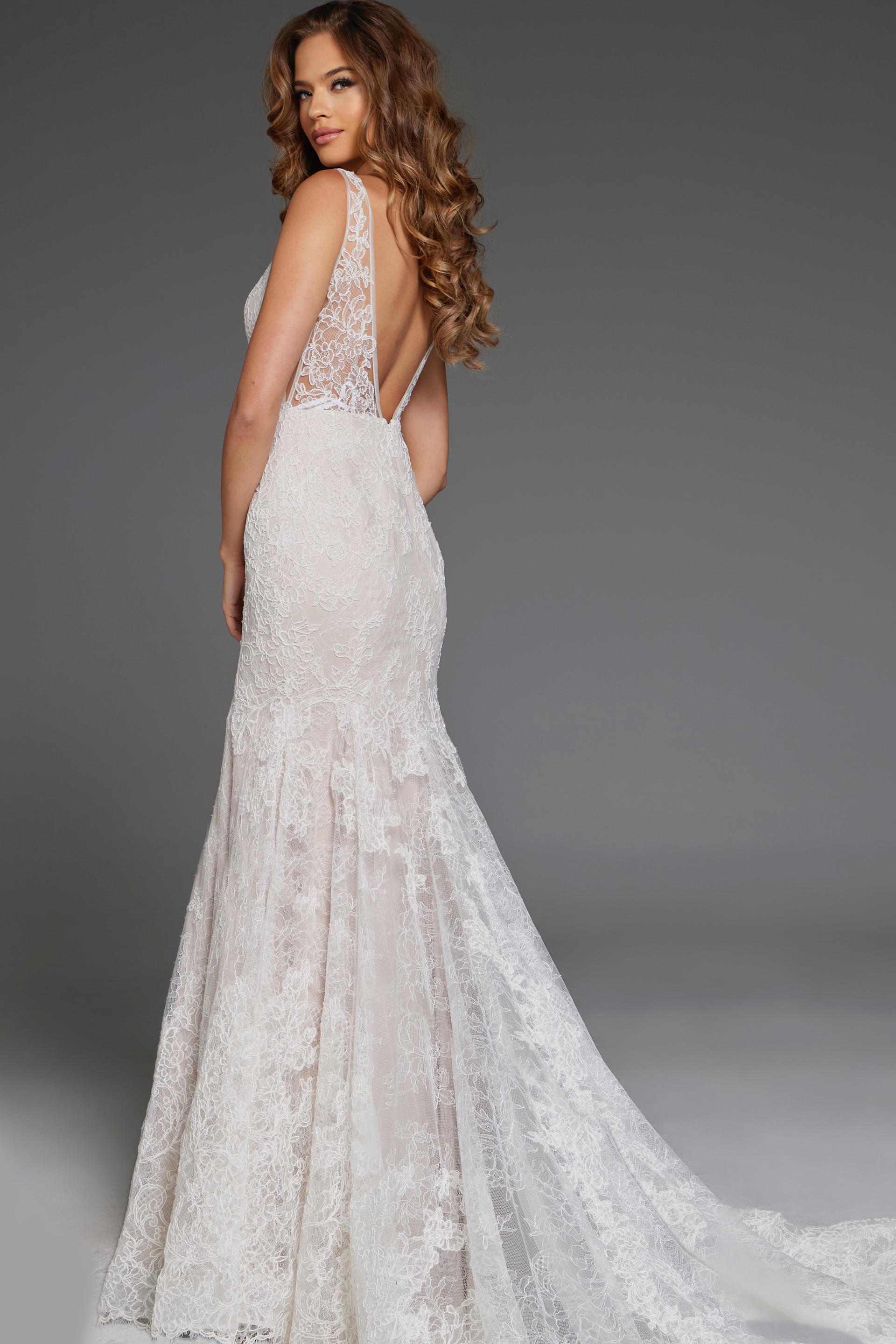 Model wearing Jovani JB43894 ivory lace dress back view