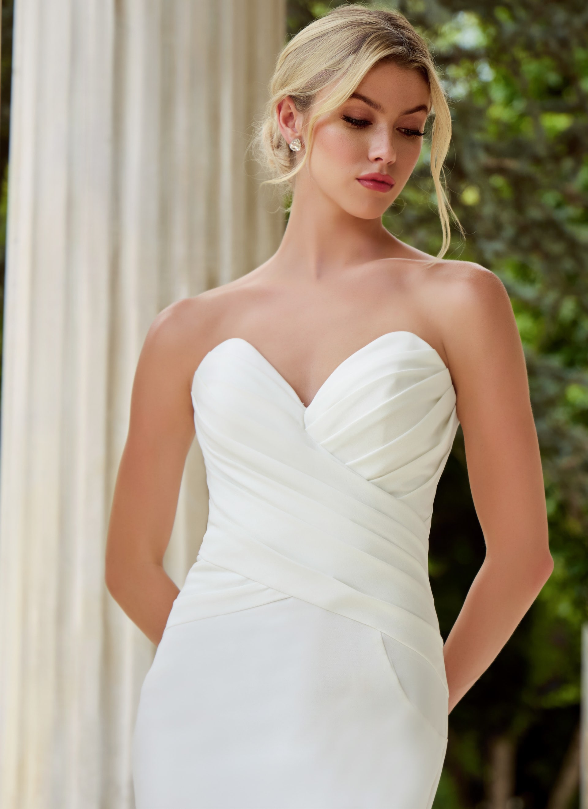 model wearing v neck ruched bodice wedding dress JB45121
