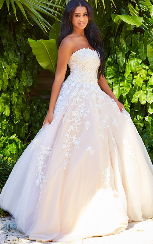 Model wearing Jovani 1831 ball gown in white, front view
