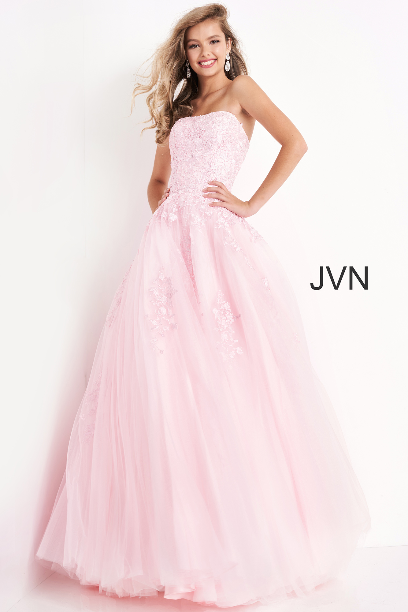 Model wearing Jovani 1831 ball gown in pink, side view