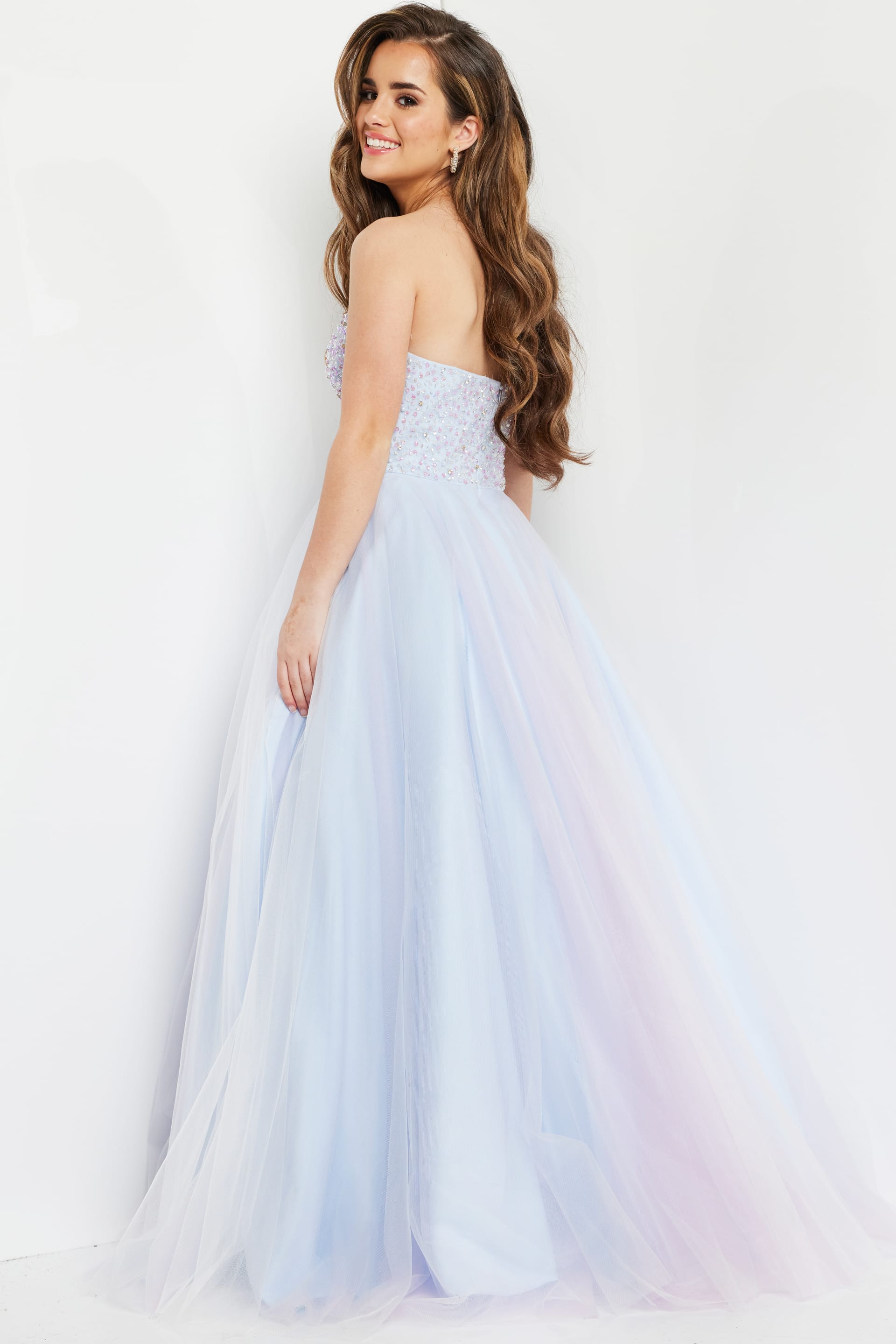 model wearing Jovani K02229 blue back view gown with elegant tulle skirt