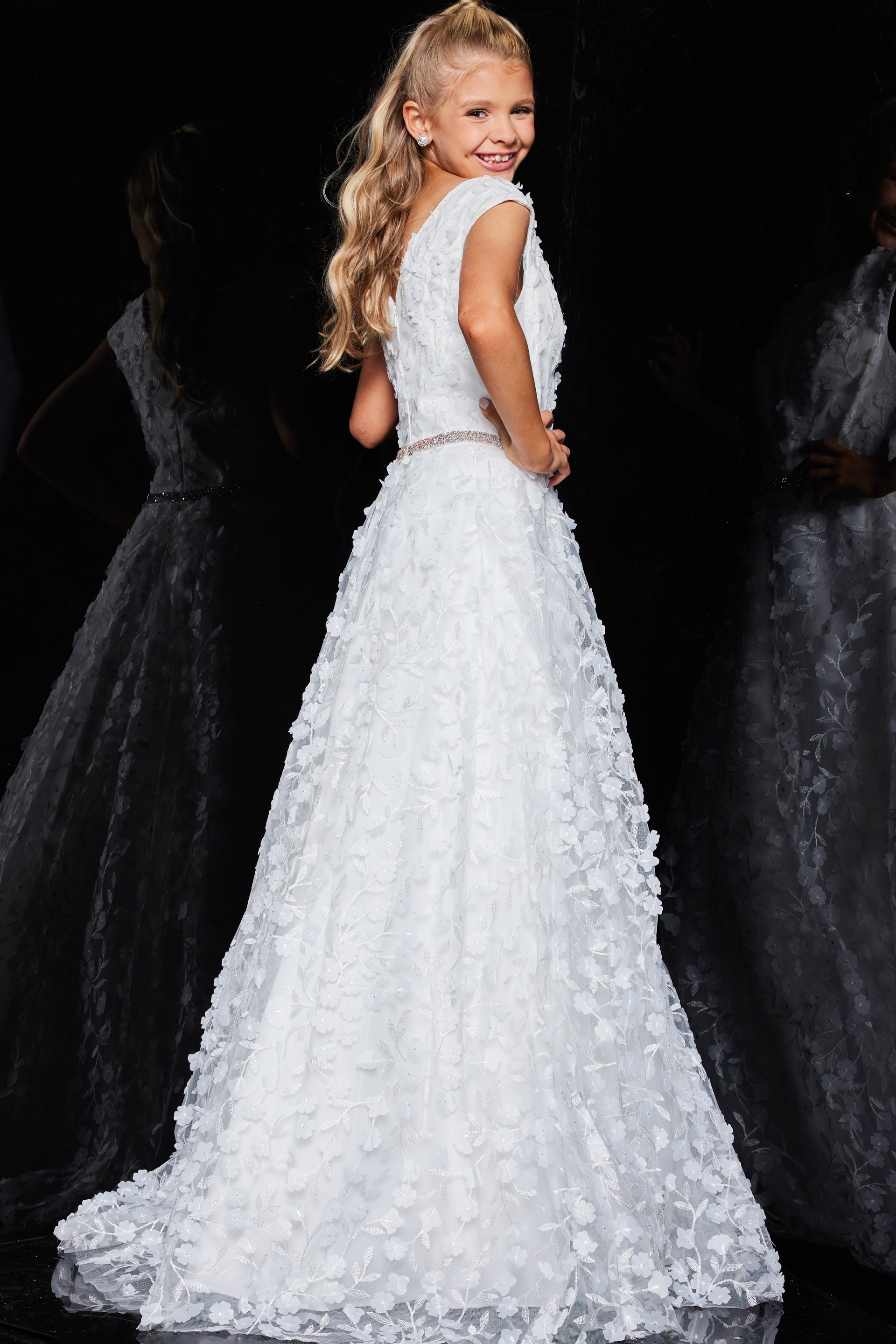 Rear view of Jovani K07245 ivory gown with an elegant A-line silhouette.
