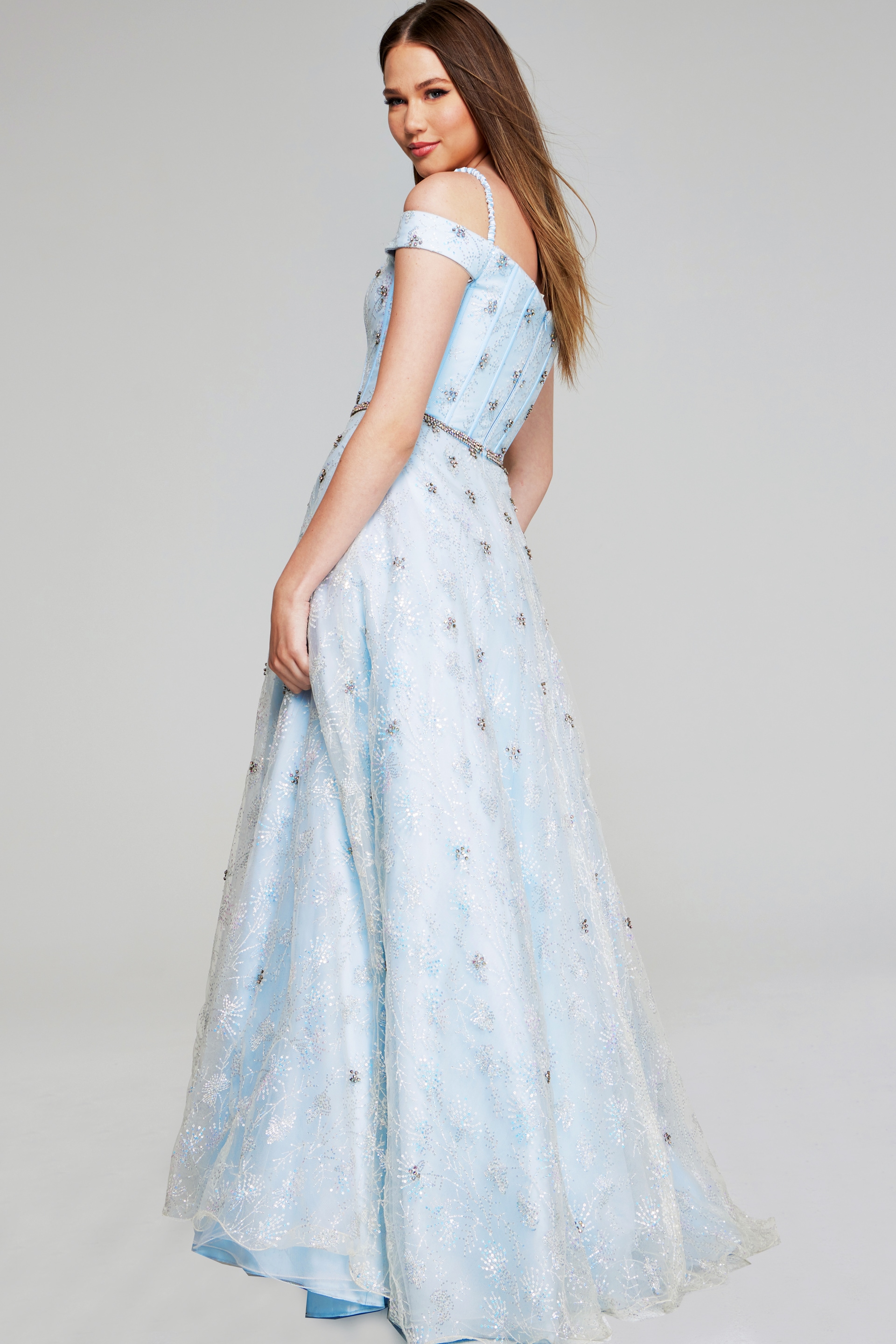 Model in Jovani K07282 light blue dress, showcasing the back design.