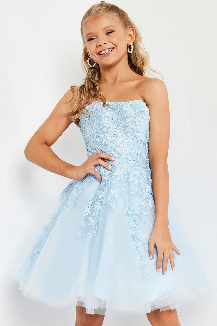model wearing K1830 blue dress with floral lace design, front view