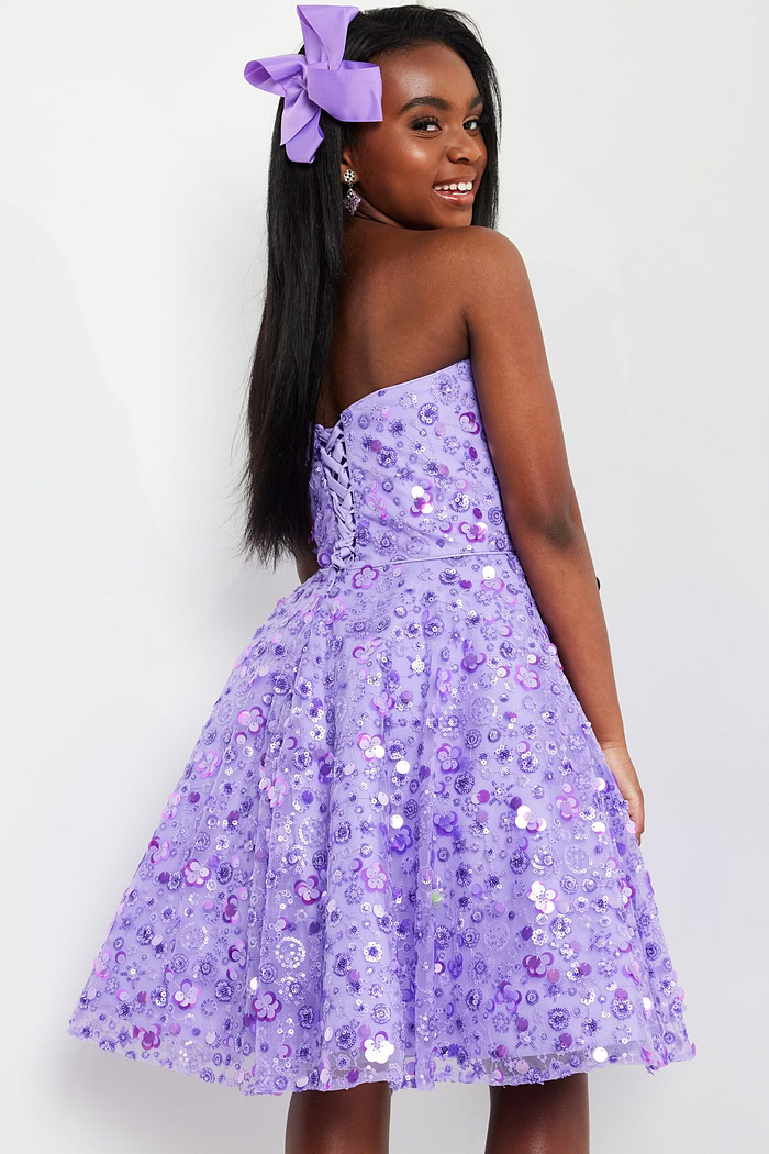 Model wearing Jovani K23685 lilac dress showing lace-up back detail