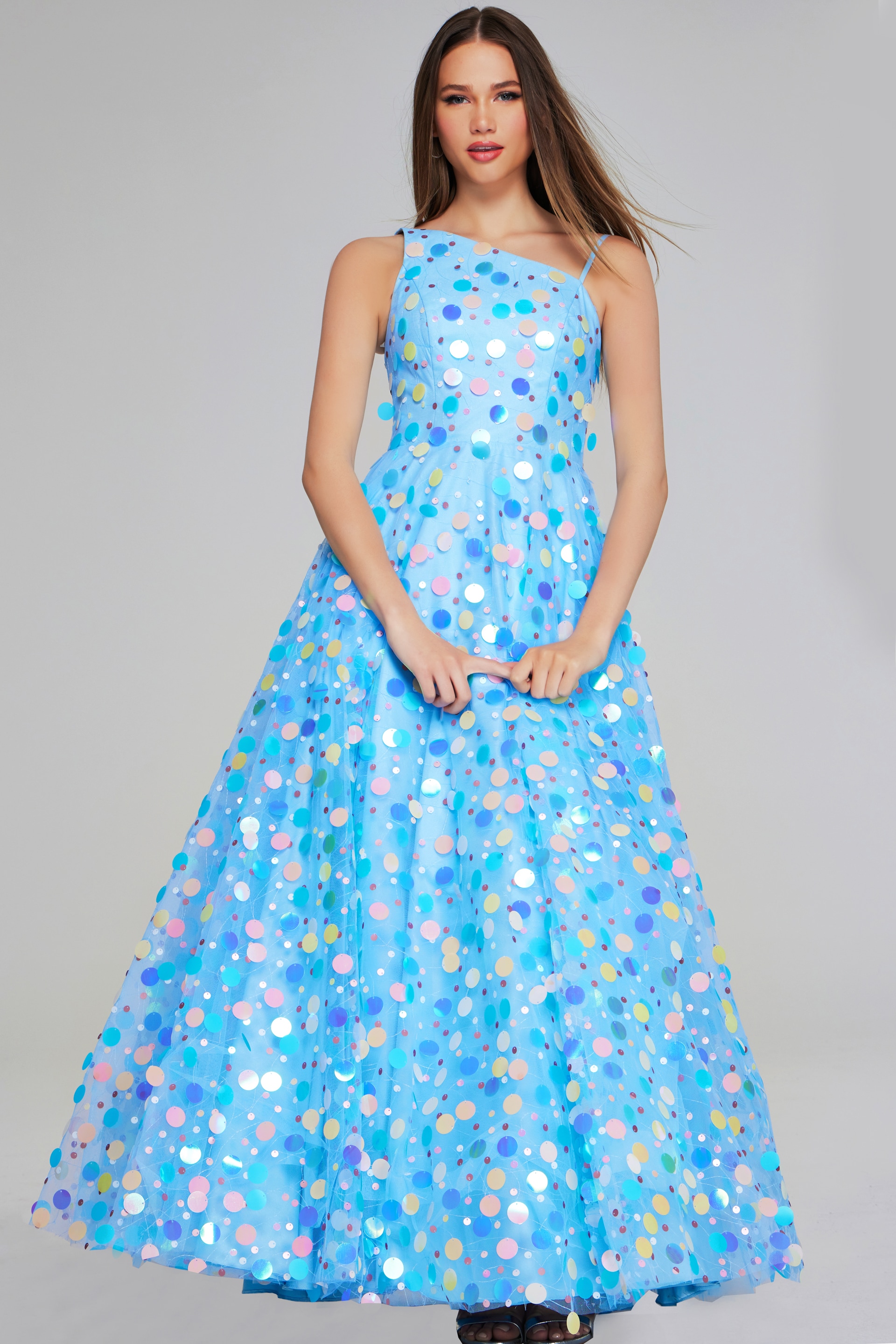 Model wearing K23877 dress from the front displaying asymmetrical neckline and vibrant colors.