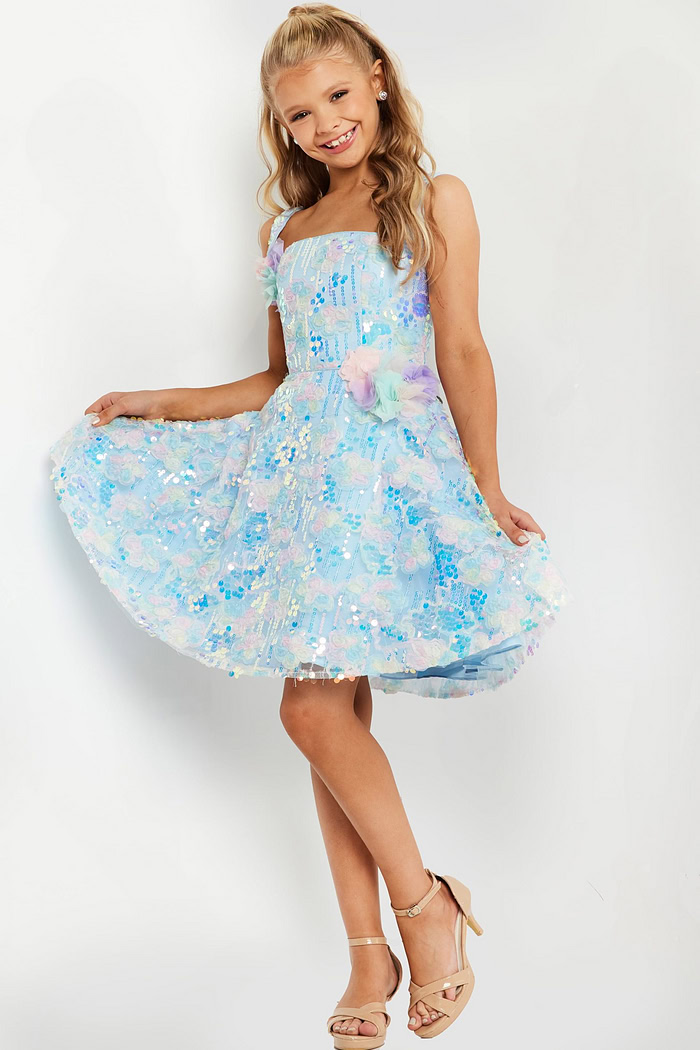 Model in Jovani K23956 dress with flared skirt.