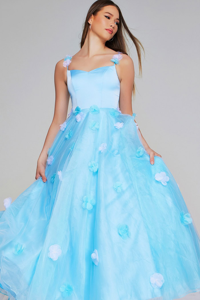 Model wearing Jovani K25988 light blue gown with floral appliques, full front view.