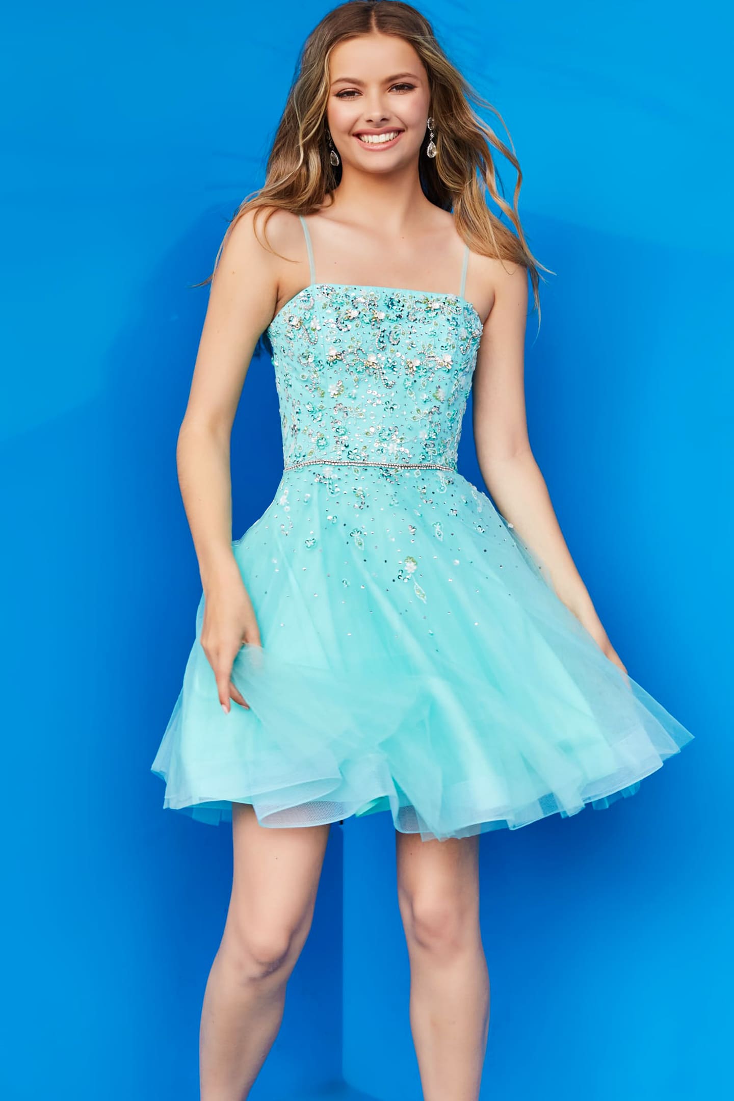 Jovani K3641 blue dress on model, emphasizing square neckline and embellishments