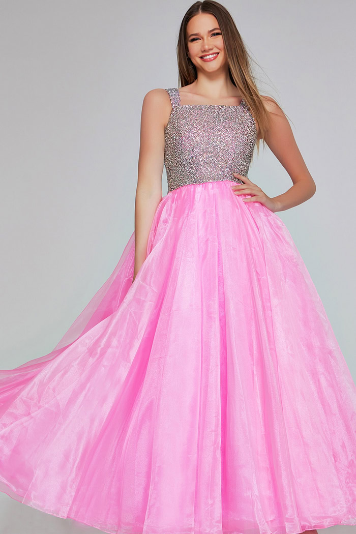 Model in Jovani K38261 pink dress with sparkling bodice, front view.