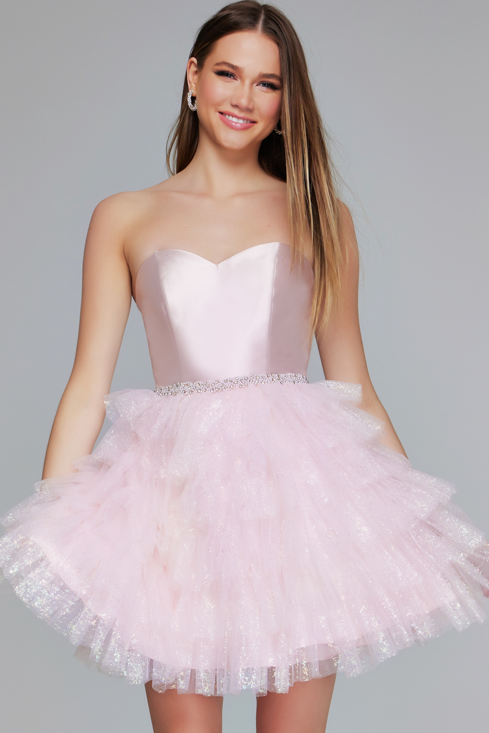 model wearing K39310 pink dress with layered tulle skirt and strapless sweetheart neckline