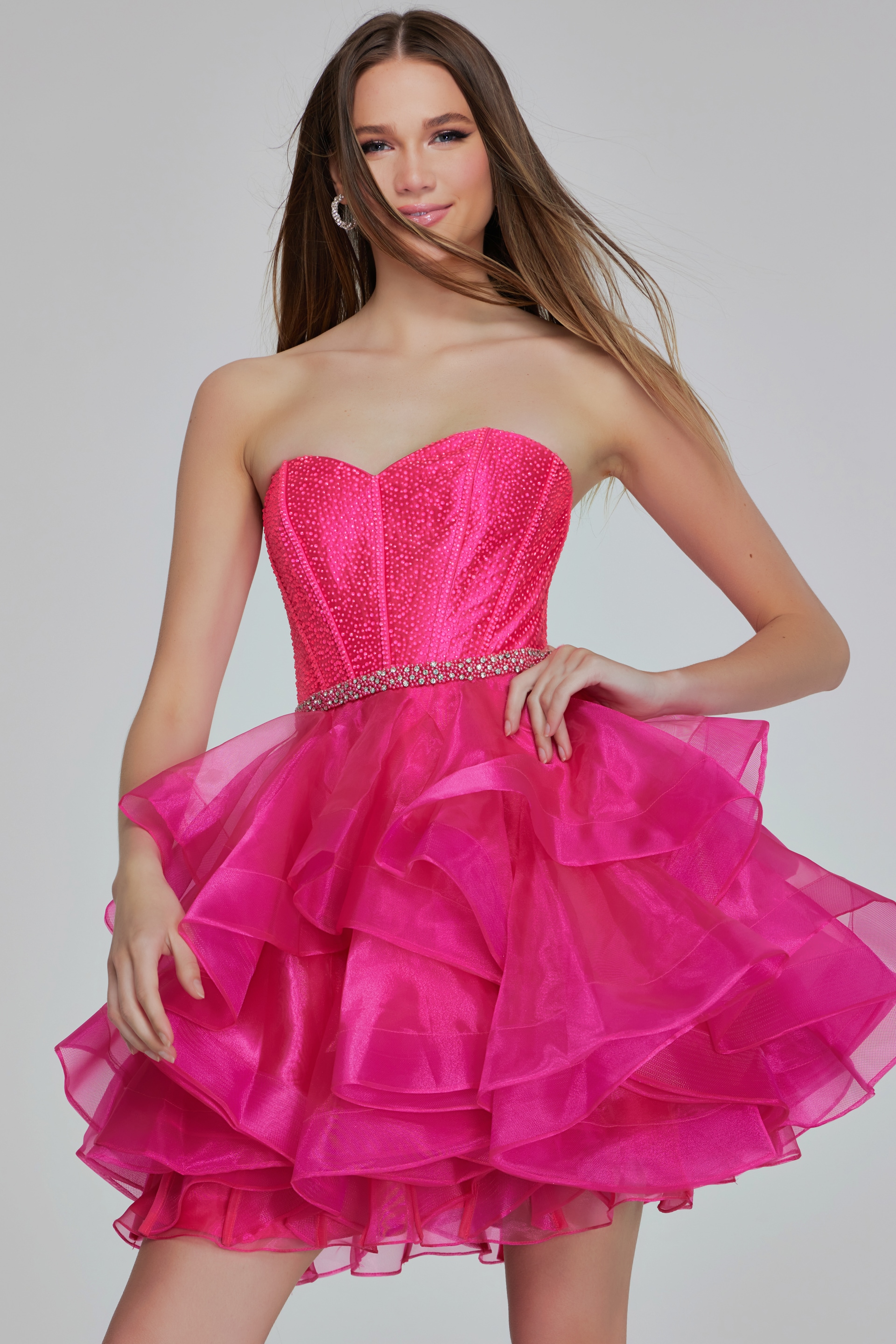 Model in Jovani K39311 hot pink dress with exquisite sweetheart neckline.