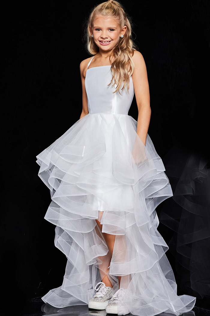 Model wearing Jovani K66708 white dress with square neckline and ruffled skirt.