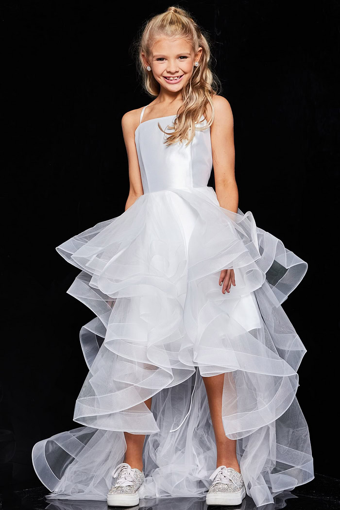 Front view of young model wearing Jovani K66708 white dress with tiered ruffle skirt.