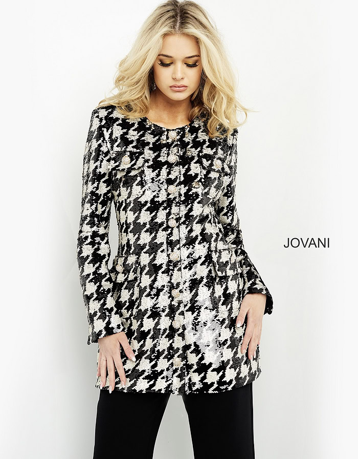 Model in M3393 black and ivory houndstooth dress, front view.