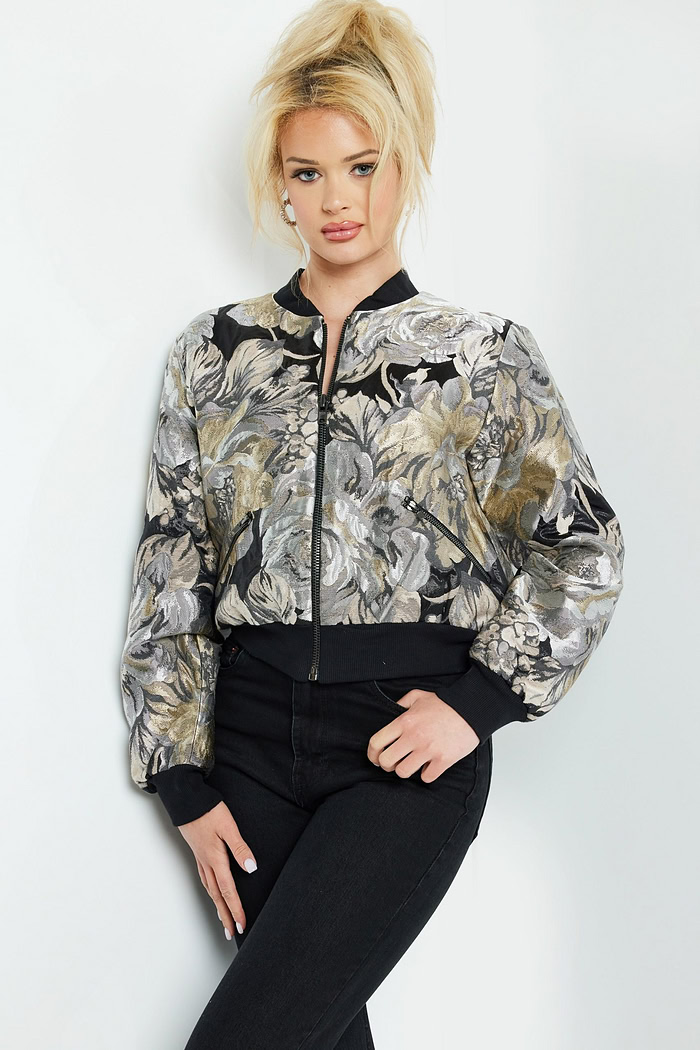 Front view of model wearing Jovani M51288 multi-colored floral bomber jacket.