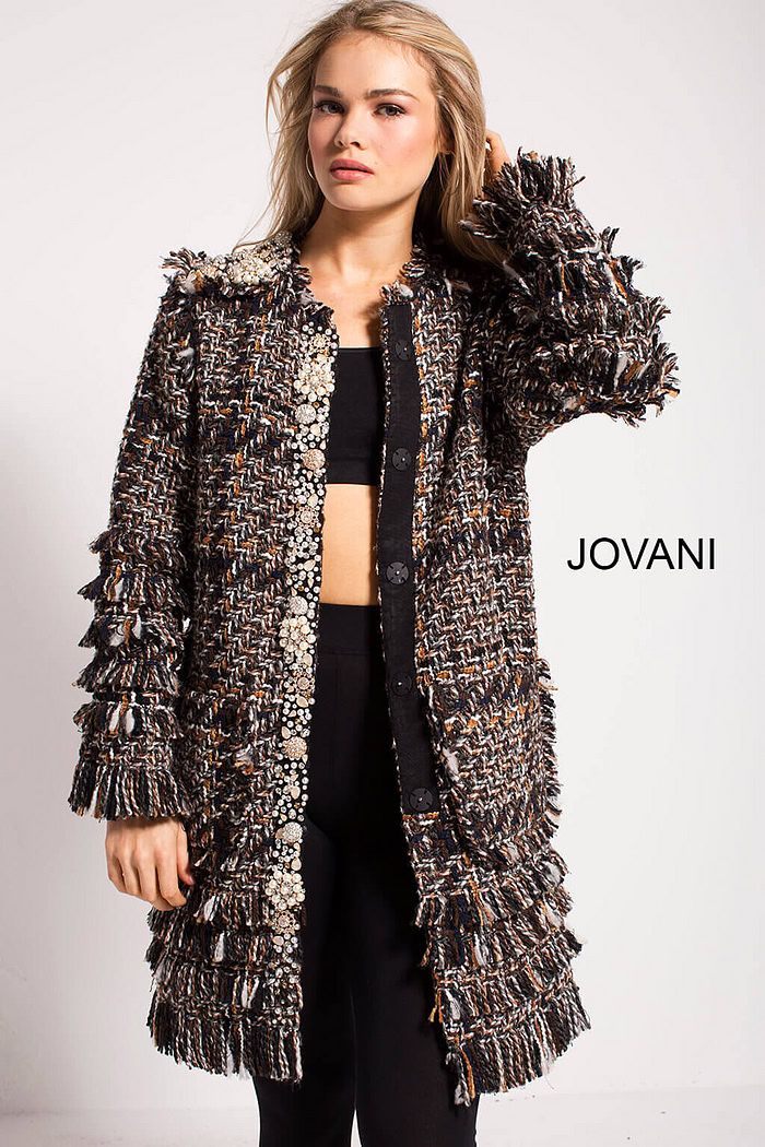 Model showcasing Jovani M54805 coat with intricate textures and embellishments from the front