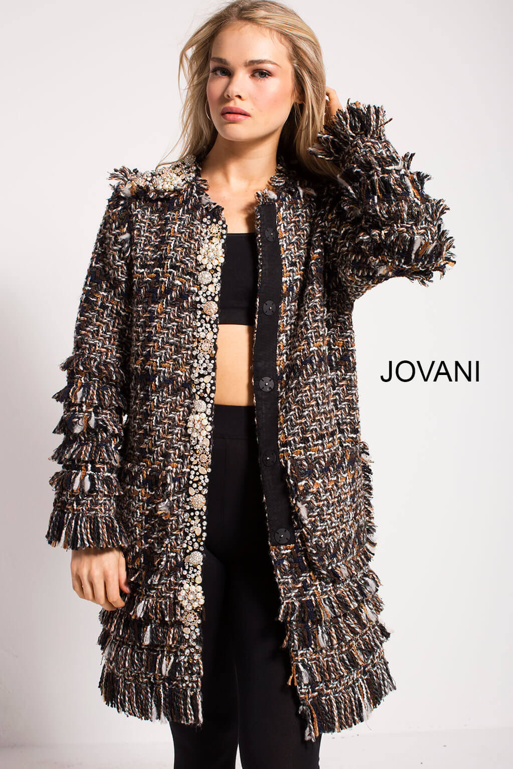 Model showcasing Jovani M54805 coat with intricate textures and embellishments from the front