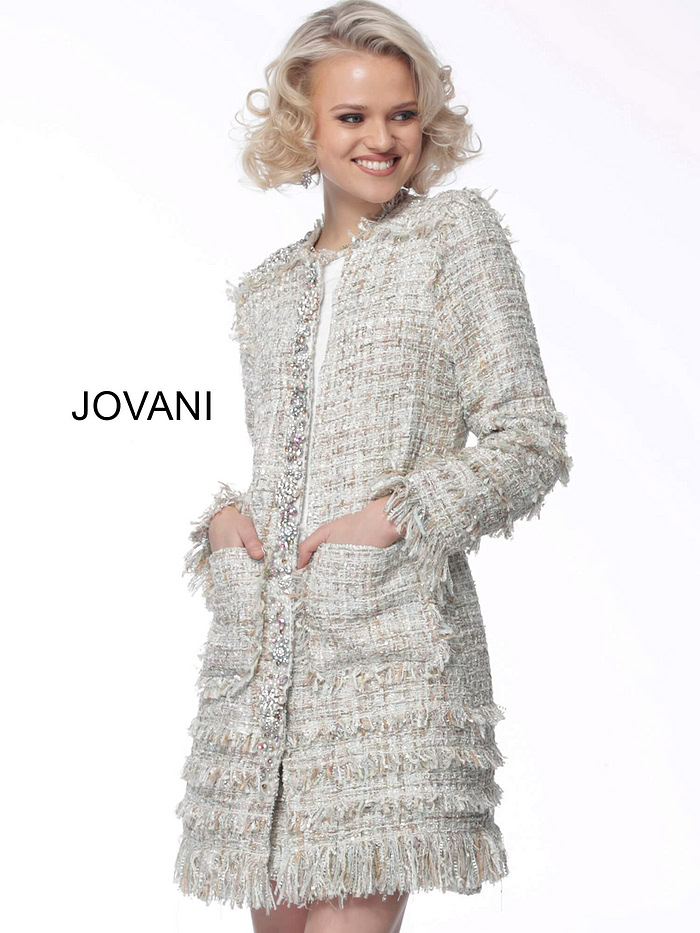 Model wearing Jovani M61371 in ivory multi-color, front view with embellished pockets.