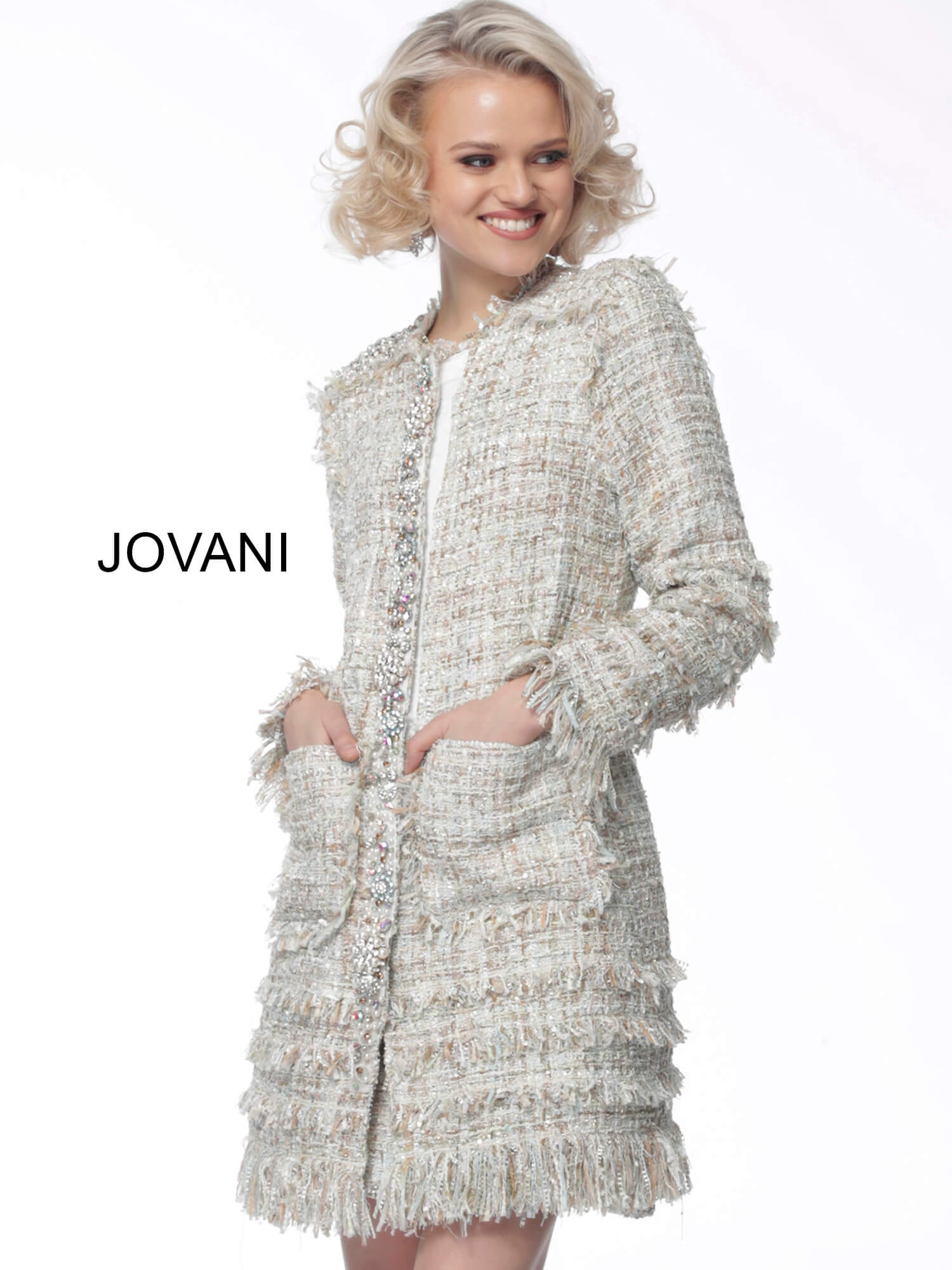 Model wearing Jovani M61371 in ivory multi-color, front view with embellished pockets.