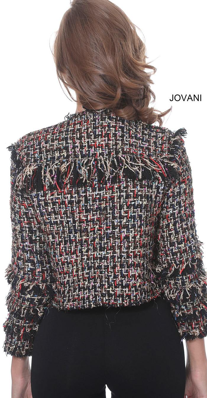 Back view of model wearing Jovani M61374 jacket showing textured fabric.