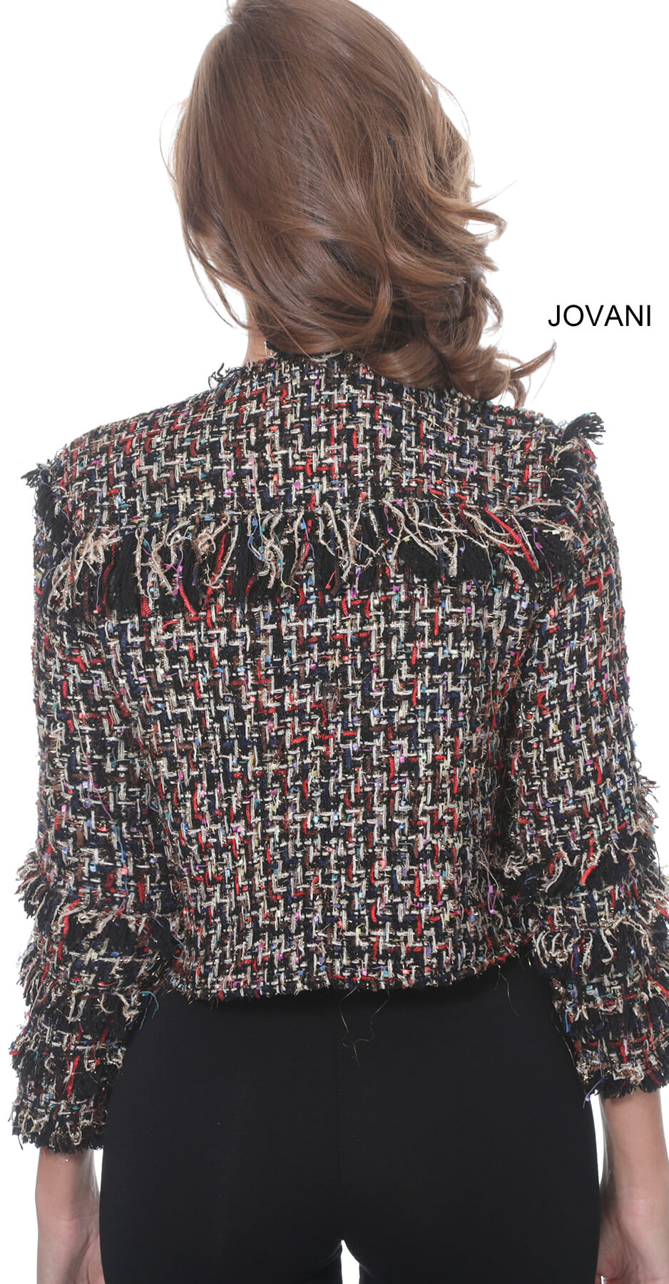 Back view of model wearing Jovani M61374 jacket showing textured fabric.