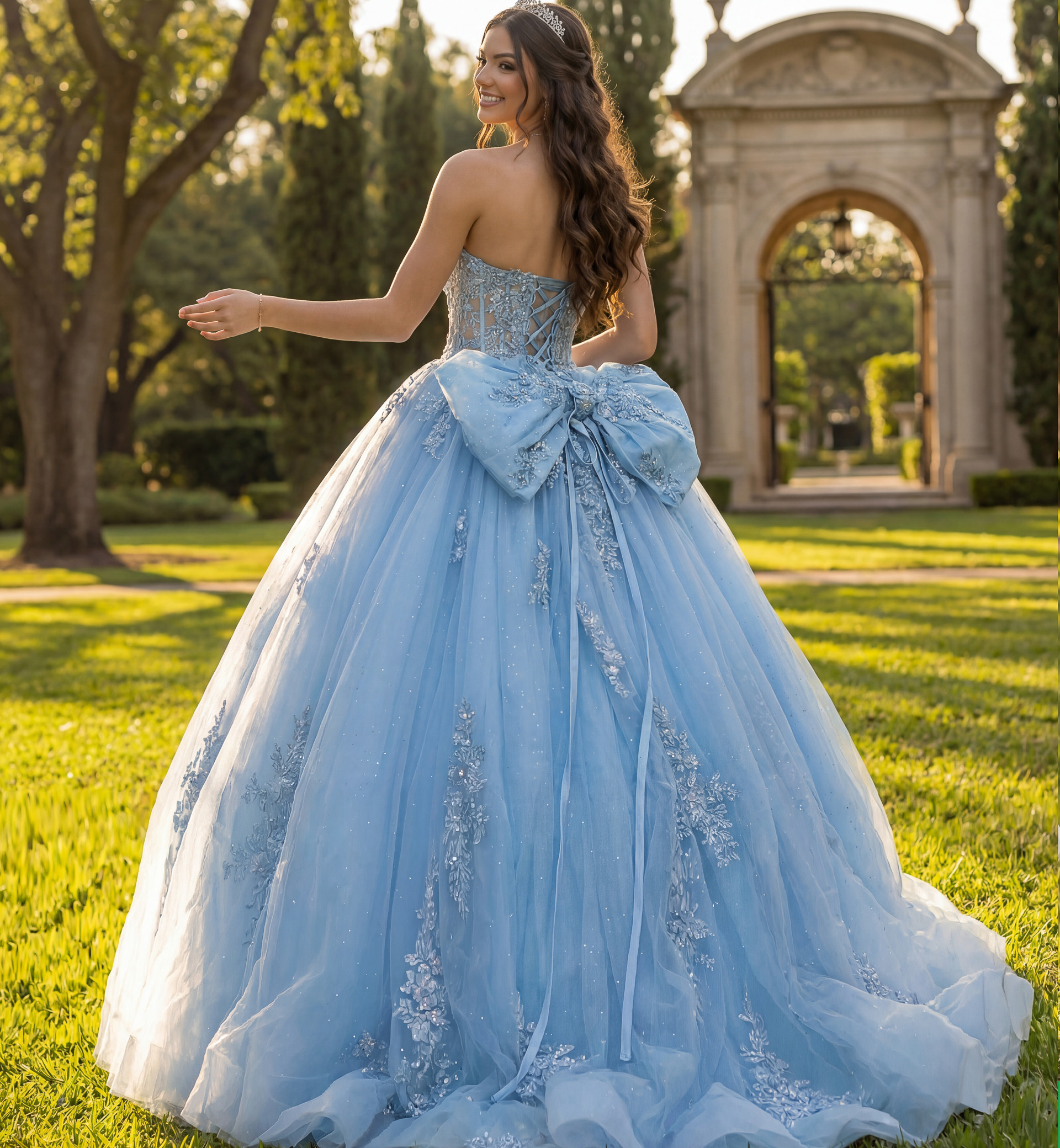 Back view blue corset ball gown with statement bow and sparkling tulle train