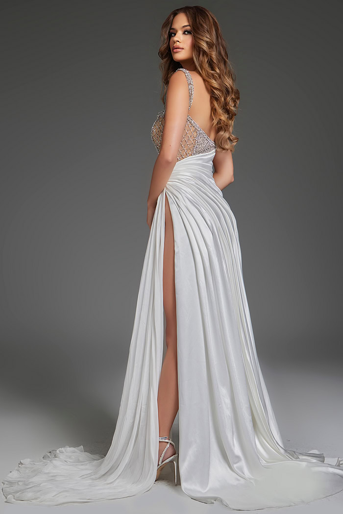 Model wearing Jovani S40406 white gown showcasing the elegant back drape and high slit.