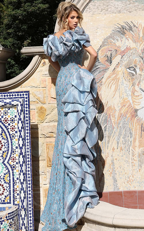 Light blue embellished dress featuring structured sleeves and high slit