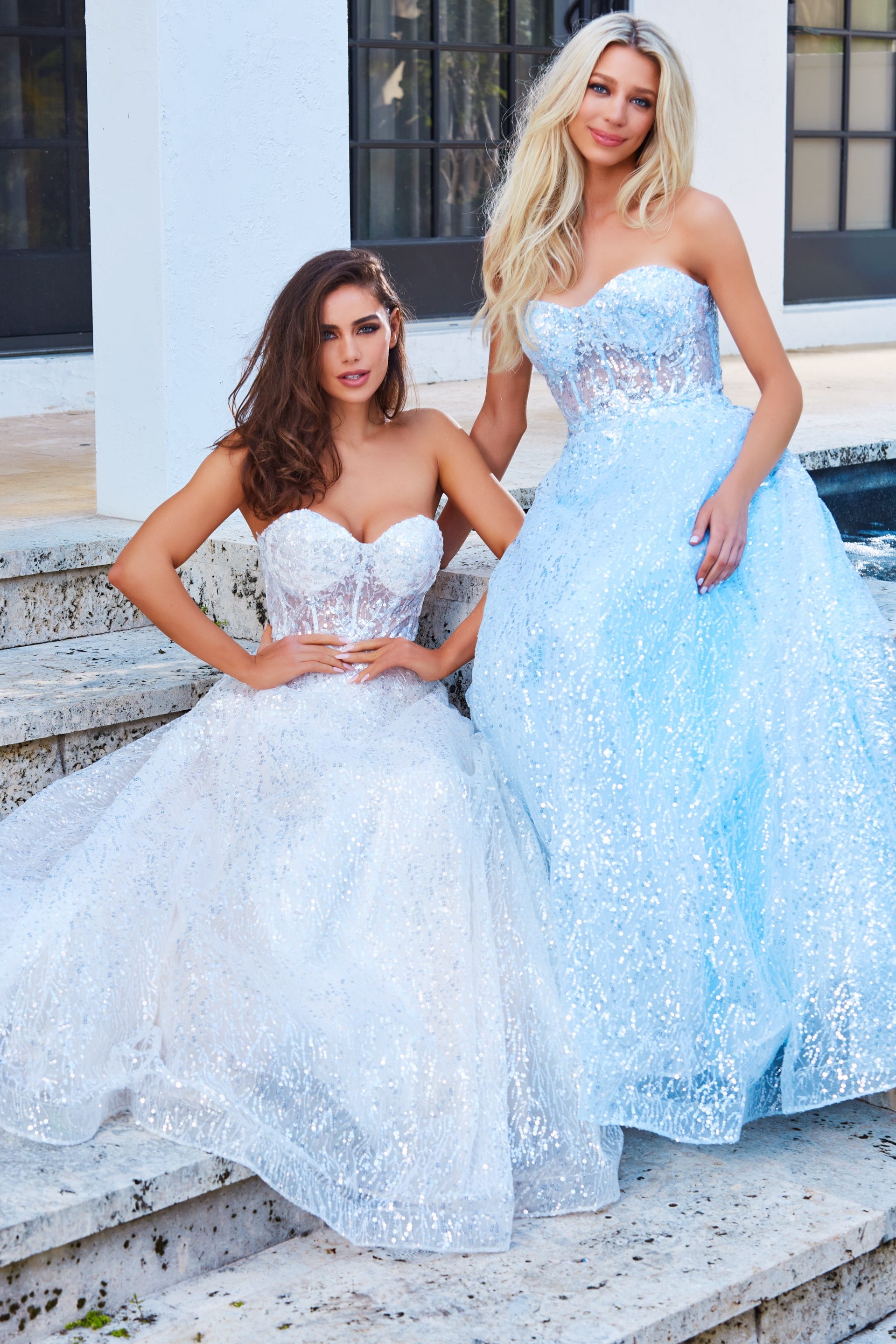 Model wearing Jovani 08417 A-line dress in blue and ivory with sequin details.