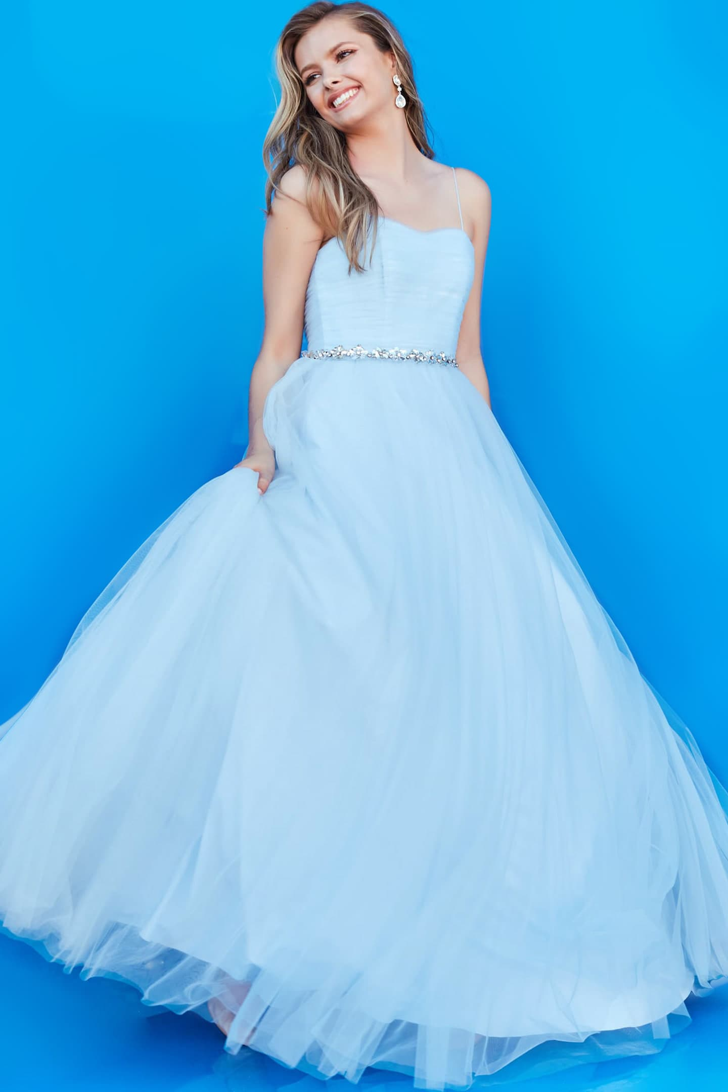 Jovani k66712 blue gown with sweetheart neckline, flowing tulle layers, and embellished waistband.