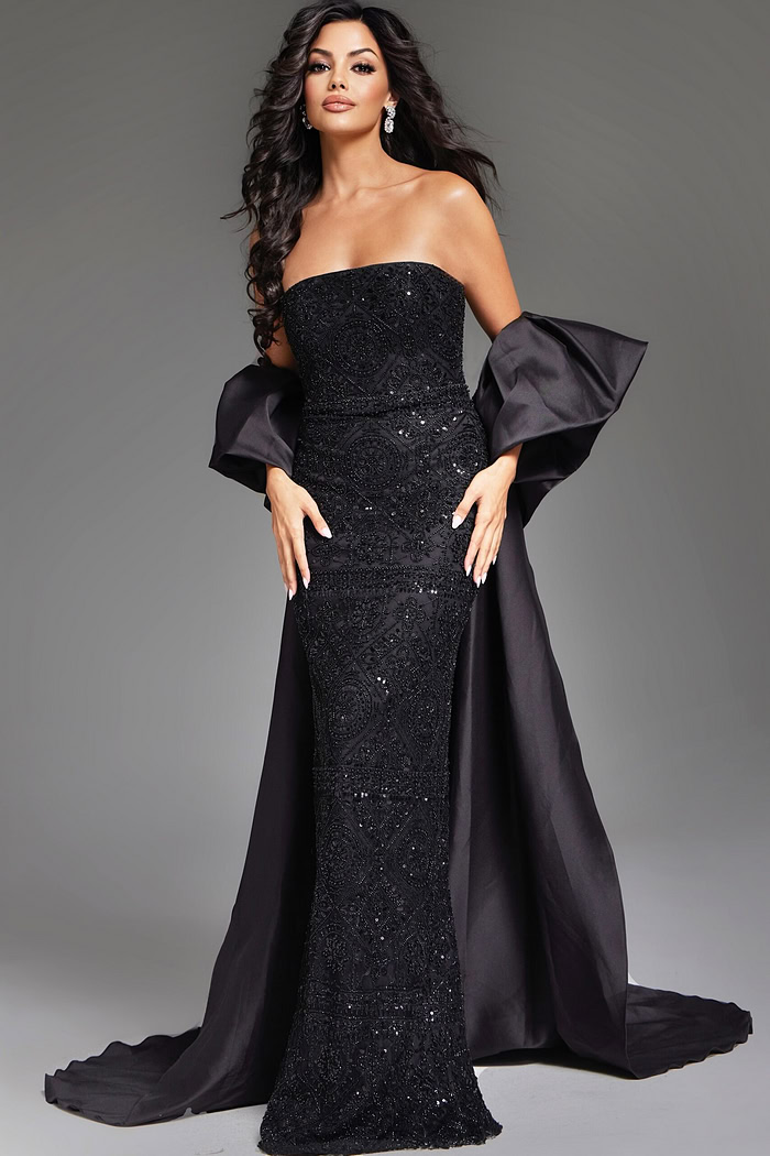 Model wearing Jovani 42137 black evening gown with embellishments, front view